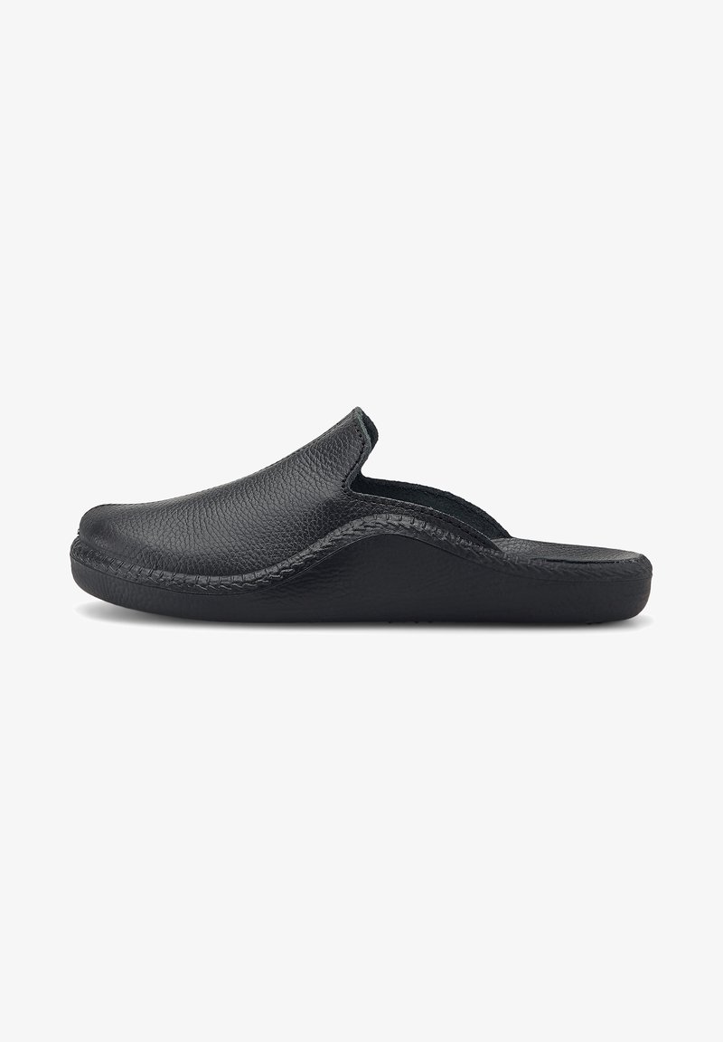 Black leather slip-on clog with textured upper, curved design, and a padded interior. Flat rubber sole for comfort and stability.