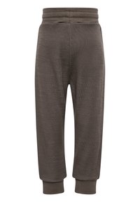 Bruna sweatpants med en mjuk textur, avsmalnande ben, en ribbad midja och manschetter vid anklarna, med ett subtilt, melerat mönster.