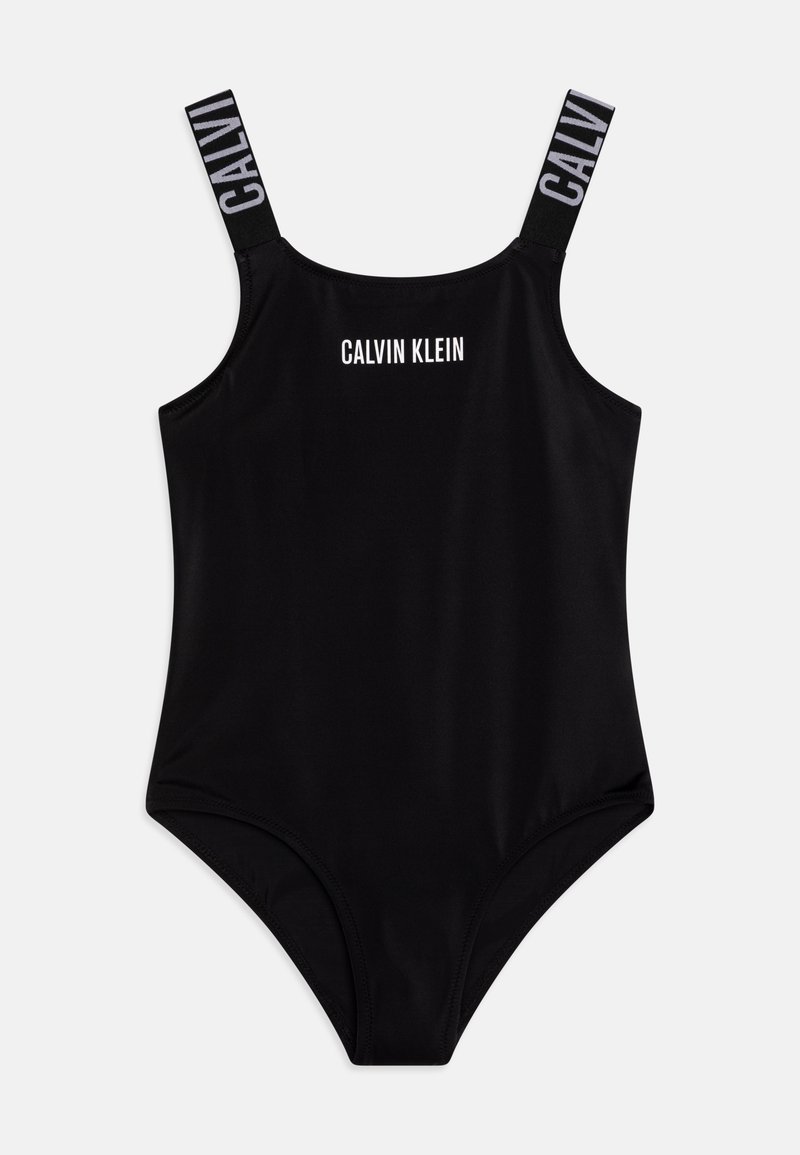 Črni enodelni kopalni kostim z tankimi naramnicami, s "CALVIN KLEIN" logotipom spredaj in črnimi napisi na belih poudarkih. Gladek, elastičen material.