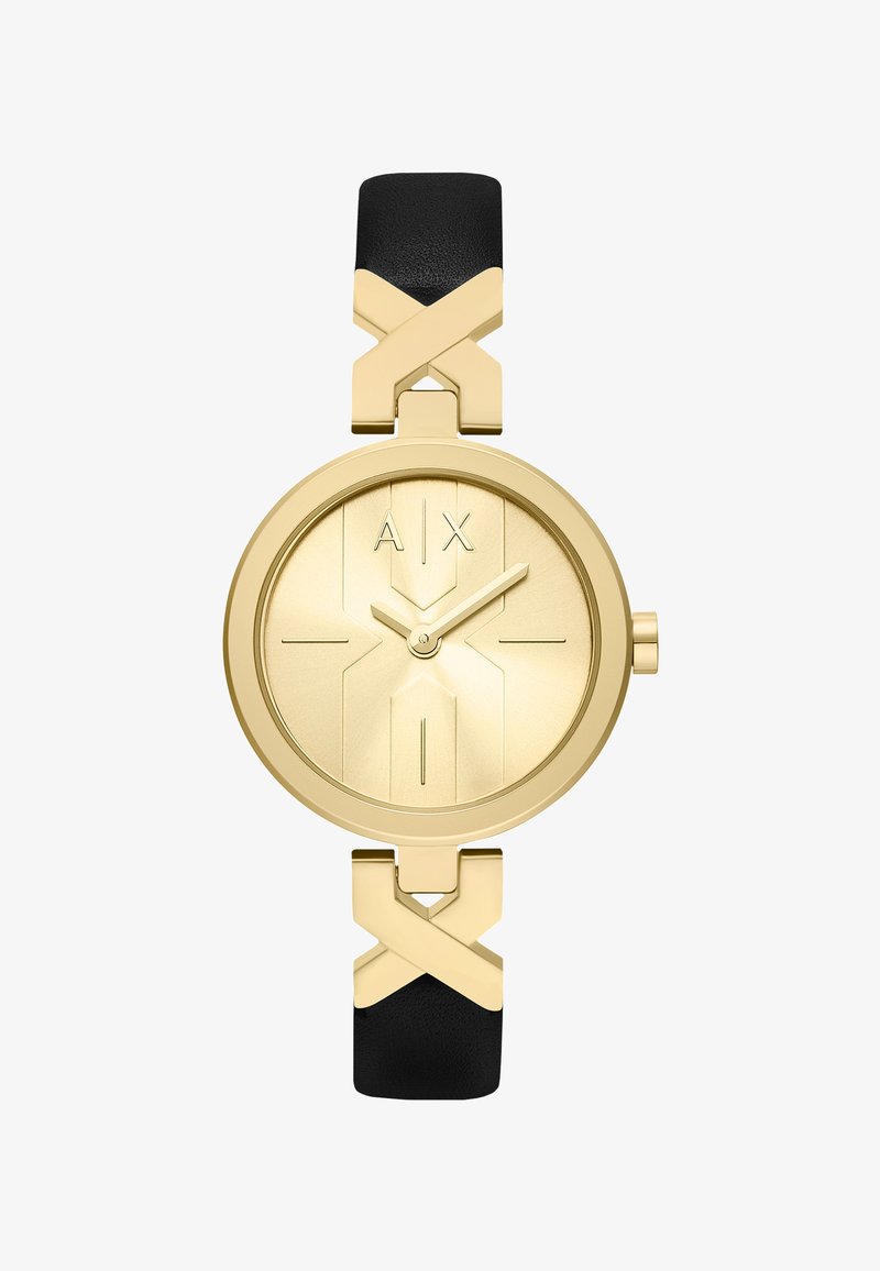 Guld rund ur med minimal urskive, gyldne visere, "A | X" logo og sort læderrem med gyldne X-formede forbindelser.