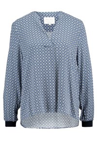 Blau-weiße geometrisch gemusterte Bluse mit langen Ärmeln, schwarzen Bündchen und einem abgerundeten Ausschnitt.