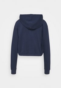 Sweat à capuche court bleu marine avec manches longues, capuche et poignets côtelés, vu de dos sur fond blanc.