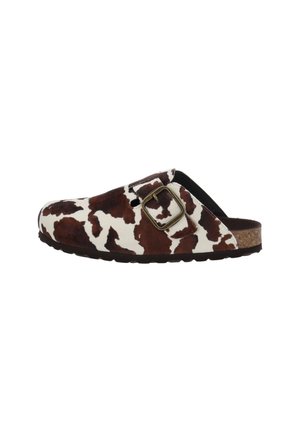 Brown and white cow print slip-on shoe with a large metal buckle and cork sole.