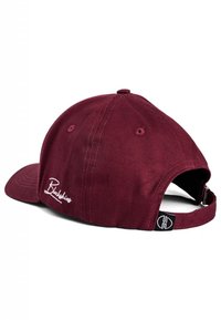 Maroon baseball cap made of cotton with a curved brim, embroidered logo on the back, and an adjustable strap for size.