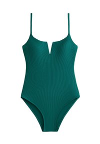 Grön baddräkt med en del och tunna axelremmar, V-ringning och texturerad väv. Har högskurna ben och en figurnära design.