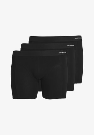 Caleçons boxers noirs, paquet de trois, fabriqués à partir d'un tissu lisse, avec une large ceinture élastique portant le logo "JACK & JONES". Sans motifs.