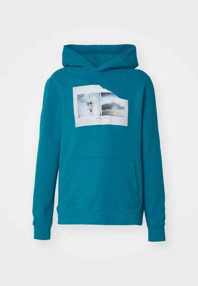 Teal hooded sweatshirt with front pocket and graphic print of two photos labeled "Los Angeles - Colorado 2017" on chest.
