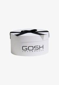 Round white gift box with a black satin ribbon. Features "GOSH COPENHAGEN" printed in black on the front. Smooth texture.