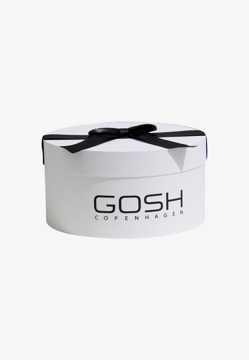 Round white gift box with a black satin ribbon. Features "GOSH COPENHAGEN" printed in black on the front. Smooth texture.