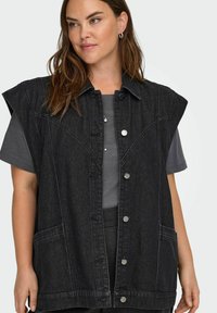 Zwarte denimvest met een kraag, knopen aan de voorkant en grote zakken. Gemaakt van katoen met een licht versleten textuur en een casual ontwerp.