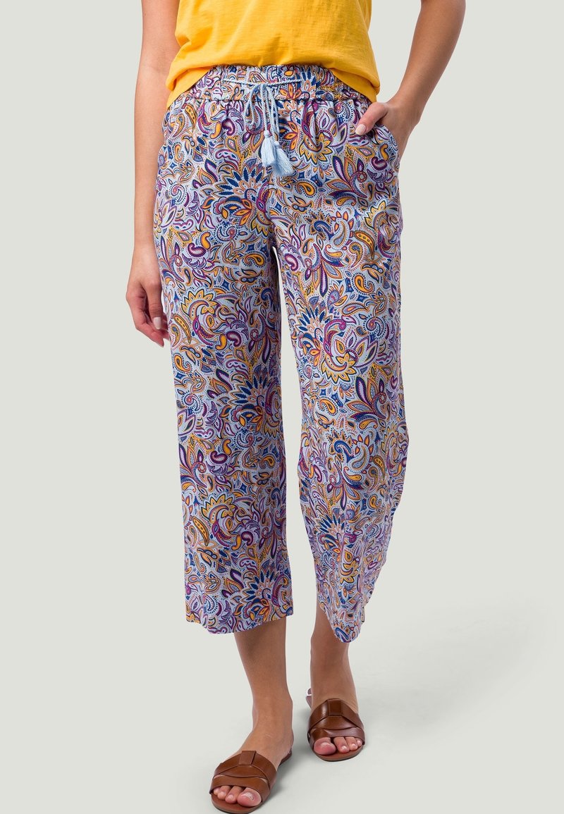 Pantalon à taille élastique avec un motif paisley violet, orange et jaune. Tissu léger, coupe décontractée et longueur cropped.