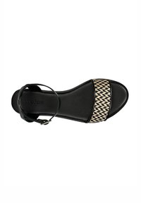Black sandal with a textured woven strap featuring a black and beige pattern. Adjustable ankle strap and smooth black sole.