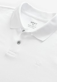 Next Piké - white bulldog embroidery