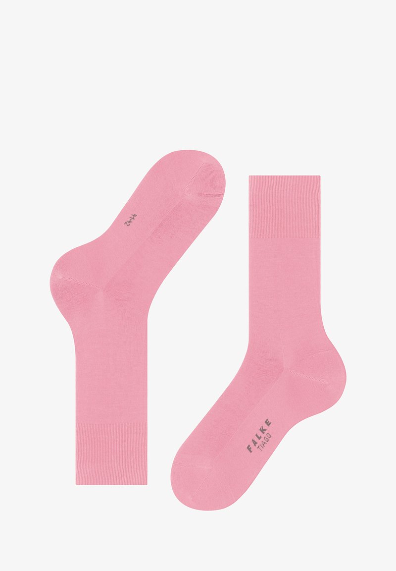 Calzini di cotone rosa con una texture liscia, dotati di un bordo a costine e punta e tallone rinforzati. Nome del marchio "FALKE" stampato in grigio.