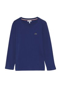 Granatowa koszulka z długim rękawem, wykonana z bawełny, z okrągłym dekoltem. Posiada zielony, haftowany logo na klatce piersiowej oraz prążkowane akcenty w okolicy szyi.