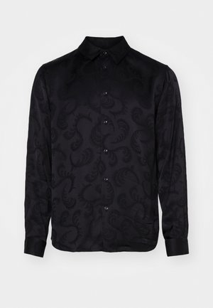 Maglietta nera a maniche lunghe con un sottile motivo paisley testurizzato, dotata di colletto a punta e chiusura frontale a bottoni. Tessuto liscio.