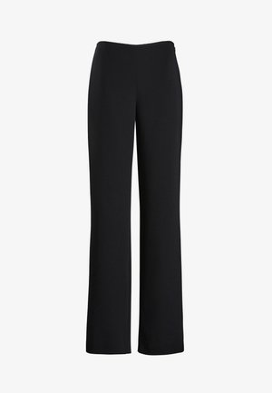 Pantalones de pernera ancha negros con una tela suave y elástica; cinturilla alta y sin cierres visibles; diseño limpio y minimalista.