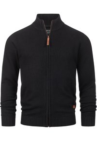 Cardigan nero a maglia con collo alto e polsini a costine. Presenta una zip frontale e un piccolo etichetta in pelle sul lato sinistro inferiore.