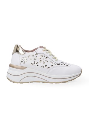 White athletic shoe with a lacy cutout design, metallic gold accents on the heel, and a thick, contoured sole for added height.