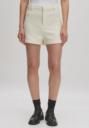 Crème-kleurige, gestructureerde shorts met een hoge taille en sluiting aan de voorkant, met een rechte snit en een zoom op dijhoogte.
