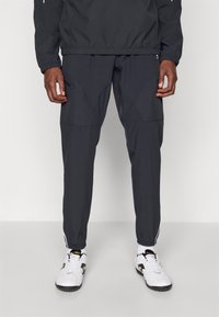 Under Armour CHALLENGER WARM UP  - Tracksuit bottoms - black/white