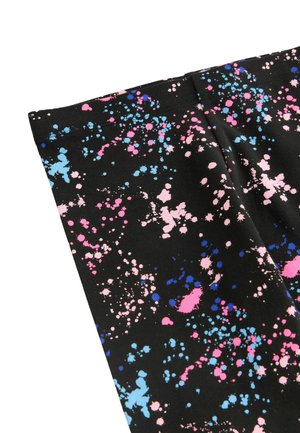 Black fabric with a splatter pattern of pink, blue, and light blue dots; smooth texture; close-up of folded fabric edge.