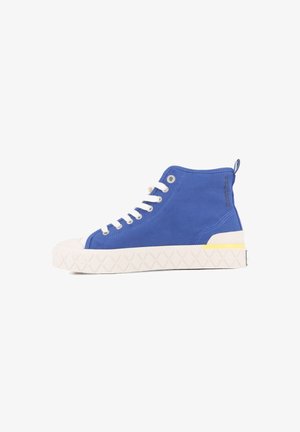 Blue canvas high-top sneakers with white rubber sole, textured grip, yellow accent on the heel, and white laces.