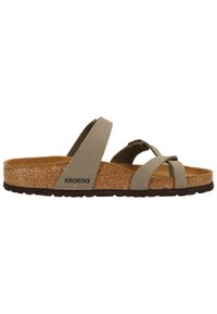 Sandales Birkenstock avec une tige gris clair, des sangles réglables et une semelle en liège. Semelle extérieure en caoutchouc texturé pour une meilleure adhérence.