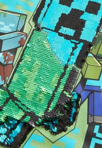 Sequin fabric featuring patterns in turquoise, green, and black. The texture is smooth with shiny disc-shaped sequins in varying sizes.