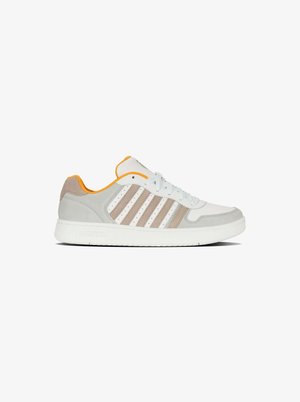 White sneaker with gray and taupe suede accents. Features three white stripes, a padded collar in orange, and a textured rubber sole.