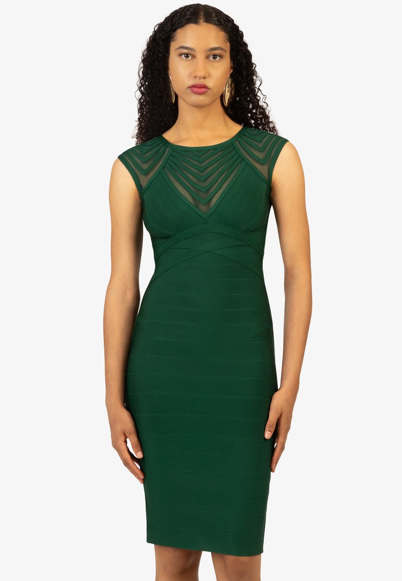 Grünes, figurbetontes Kleid mit transparentem gestreiften Overlay im Oberteil. Texturiert, knielang, mit klassischem Rundhalsausschnitt und kurzen Ärmeln.