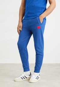 HUGO - DOAK - Tracksuit bottoms - mittelblau Thumbnail Image 1