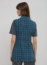 Calliope SANS MANCHES À CARREAUX - Camicia - une variante
