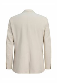 Μπεζ ραμμένο σακάκι που φαίνεται από πίσω με μακριά μανίκια, πέτο με εγκοπή και κουμπιά στα τελειώματα των μανικιών.