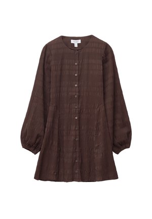 Brown, textured blouse with a button front, round neckline, and long, puffed sleeves. Features horizontal patterns and side pockets.