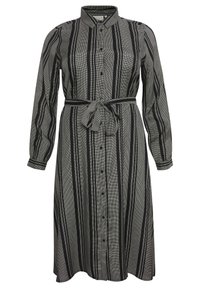 Randig svart- och vit klänning med lång ärm, knapplist och bälte i midjan. Tillverkad av lätt material med en mjuk textur.