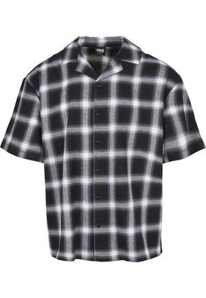 Chemise noire et blanche à manches courtes boutonnée avec un motif à carreaux et un col camp.