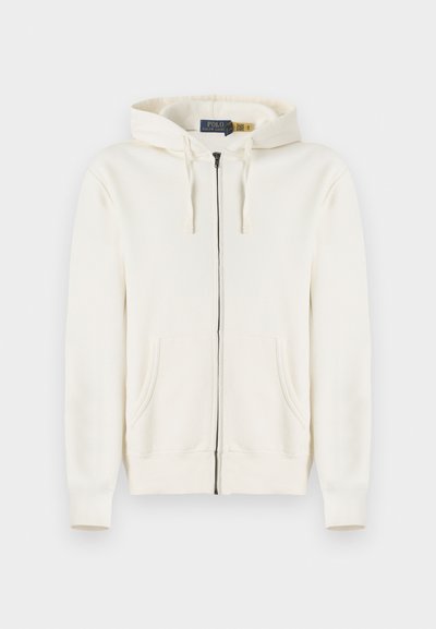 Κρεμ χρώματος φούτερ με πλήρες φερμουάρ, με μπροστινές τσέπες, κουκούλα με κορδόνι και ριμπ μανσέτες, τοποθετημένο επίπεδα σε λευκό φόντο.