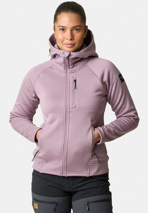 Veste en polaire lilas clair avec capuche, fermeture éclair sur le devant, poches latérales et coupe ajustée. Tissu texturé avec des accents sombres contrastants.