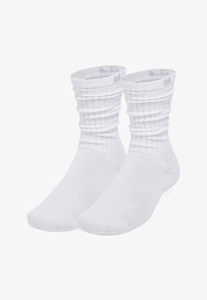 Valkoiset puuvillaiset nilkkasukat, joissa on ribbineulos, rypytetty yläosa ja saumaton varvasosa. Pehmeä pinta ja sivulla logotunniste.