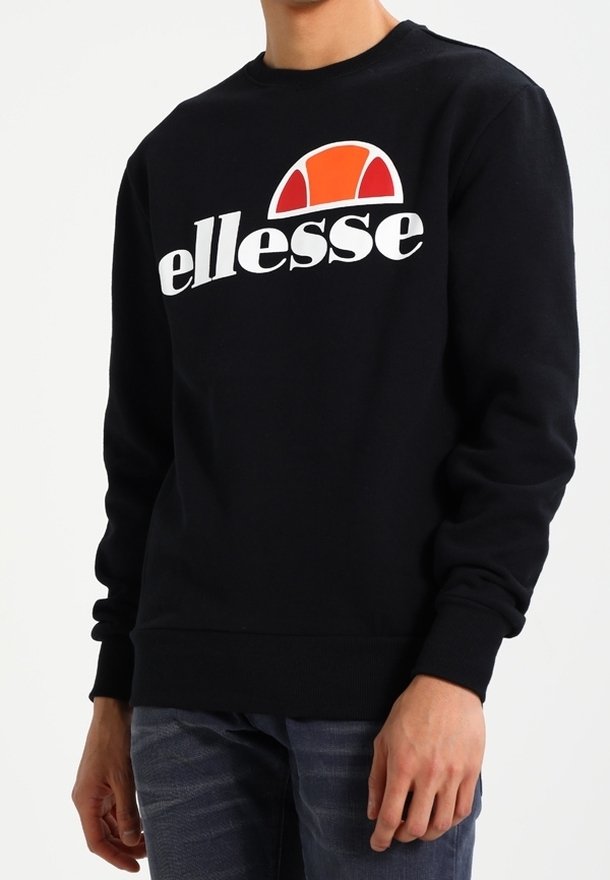 Sweat-shirt noir avec un logo "ellesse" blanc et un graphique en demi-cercle orange. Col rond classique et poignets et ourlet côtelés.