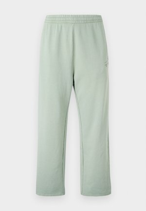 Light green sweatpants with an elastic waistband, straight cut, featuring a subtle print on the left side and soft cotton material.