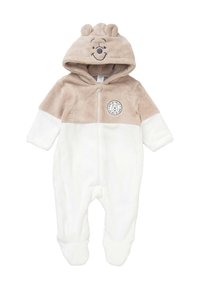 Tuta per neonati in pile beige e bianco con cappuccio, dotata di orecchie da orso e un viso di orso sorridente, zip frontale e una piccola toppa circolare a forma di orso.