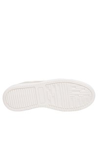 Semelle de sneaker blanche avec un motif en caoutchouc texturé, présentant des rainures pour l'adhérence et un bord lisse. Aucun logo ni détail supplémentaire visible.