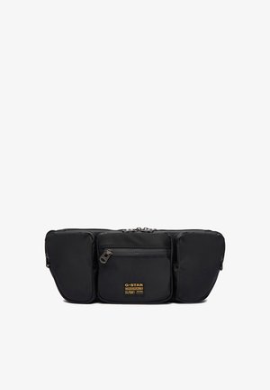 Sac banane noir de G-Star Originals avec trois compartiments zippés et écusson logo sur la poche centrale avant.