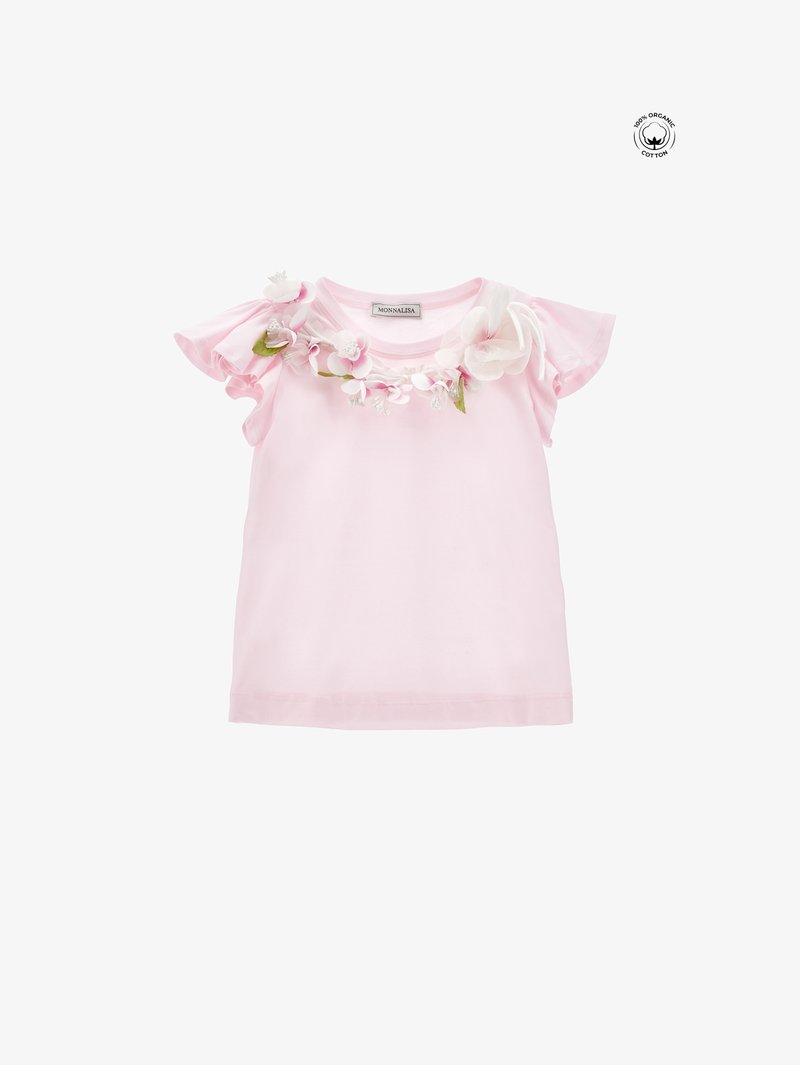 Lyserød økologisk bomulds t-shirt med rynkede ærmer og blomsterudsmykning omkring halsudskæringen. Blød tekstur med en afslappet pasform.