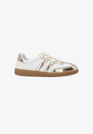 White sneakers with gold metallic accents, featuring three gold stripes, round toe, and a textured gum sole. Laces for secure fit.