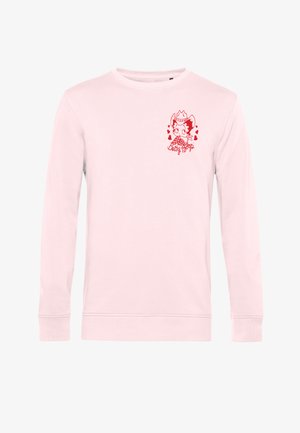 Lichtroze shirt met lange mouwen en een kleine rode afbeelding van Betty Boop met een cowboyhoed en hartjes op de linkerborst.