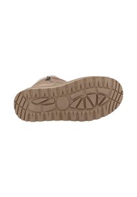 Semelle de botte beige clair avec une surface en caoutchouc texturé, présentant de profonds crampons pour une meilleure adhérence et un design de pointe arrondie.