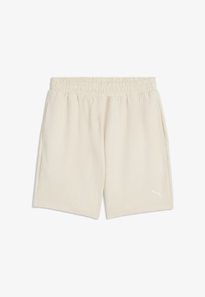 Pantalones cortos beige con cintura elástica, bolsillos laterales y un pequeño logo blanco de Puma en la pierna izquierda.
